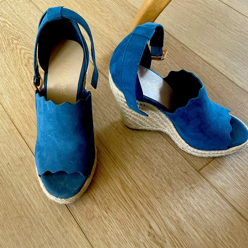 Size 5.5 blue suede espadrille style ankle strap wedge. Hardly worn. Like new!